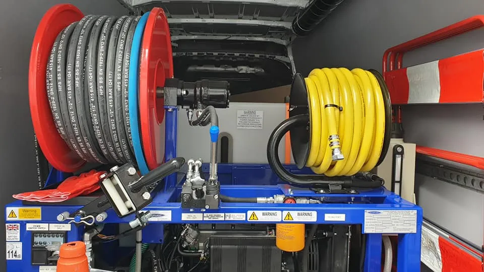 reels of cable in the back of a van